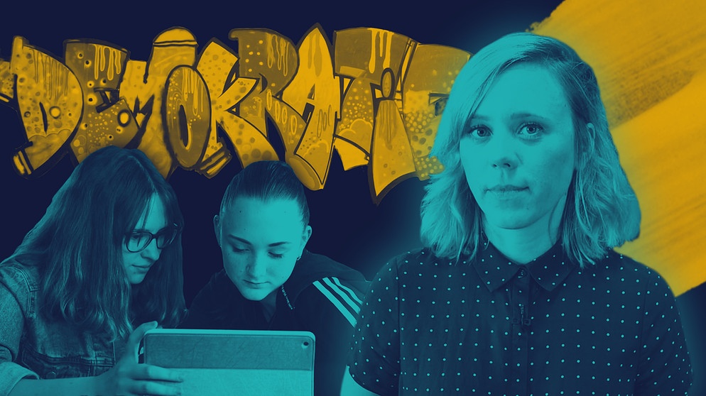 Moderatorin Christina Wolf, zwei Schülerinnen vor einem Tablet, Graffiti "Demokratie" | Bildquelle: BR